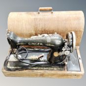 A vintage Singer sewing machine in case.