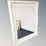 A traditional style bevelled mirror in cream frame