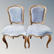 A pair of antique style dining chairs