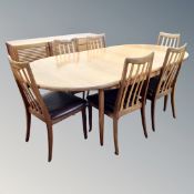 A 20th century teak G Plan extending dining table and six chairs