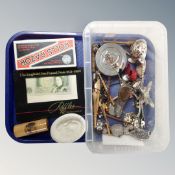 A plastic box of collector's items, lace bobbins, £1 note, grape scissors,