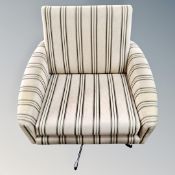 A 20th century upholstered striped swivel chair
