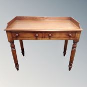 A Victorian mahogany two-drawer side table