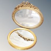 Two traditional style oval gilded mirrors