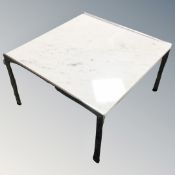 A white marble topped lamp table
