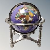 A gemstone globe with certificate.