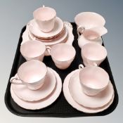 A tray of Royal Tuscan pink tea china.