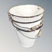 Three vintage enameled buckets.