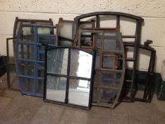 Eleven antique cast iron window inserts