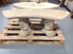 A shaped concrete bench on squirrel pedestals