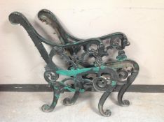 A pair of cast iron lion mask bench ends