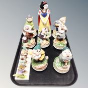 A collection of Snow White and the Seven Dwarf musical figures,