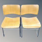 A pair of metal framed plywood chairs