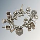 A sterling silver charm bracelet, 59g.