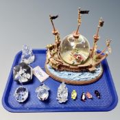 A Disney store Captain Hook model boat ornament together with a crystal and glass ornaments.