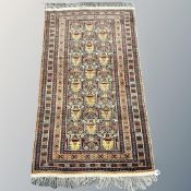 An Afghan rug of geometric design,