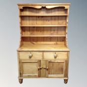 A 19th century and later pine kitchen dresser
