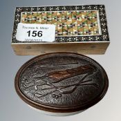 A small golf themed trinket box and intricately inlaid box with cover