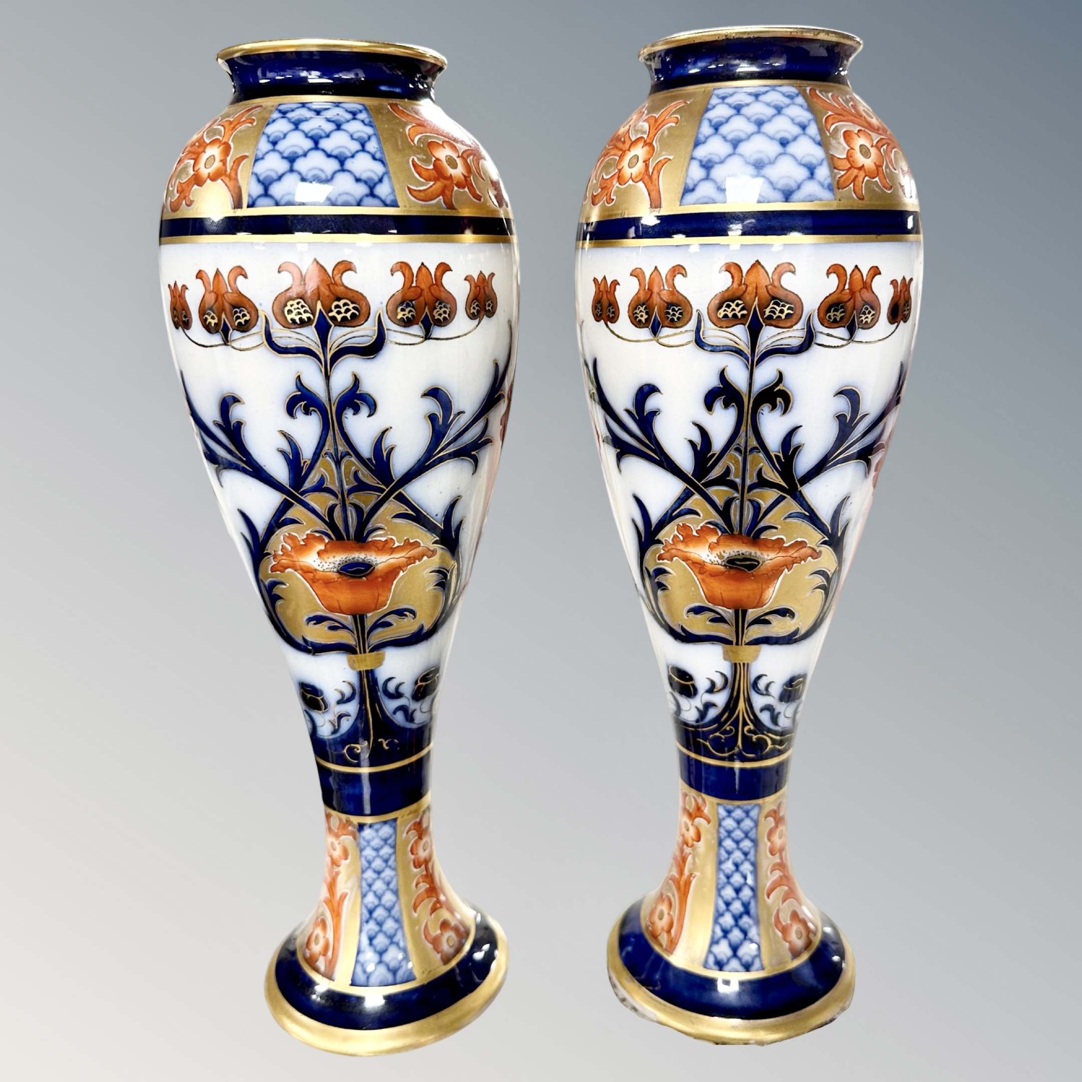 A pair of Macintyre Burslem Imari porcelain vases, height 29cm.