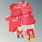 A box containing a quantity of Liverpool football club collectable's including Liverpool shirts,