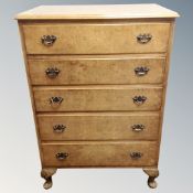 A 20th century walnut five drawer chest