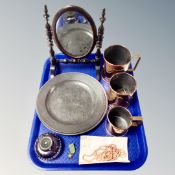 Two antique pewter plates together with a graduated set of copper measures,