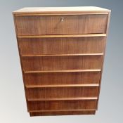 A mid century teak six drawer chest