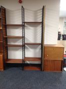 A four bay Ladderax mid century teak adjustable shelving unit with metal extension bay (no further
