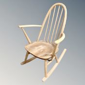 An Ercol white elm rocking chair