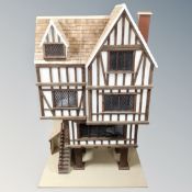 A Tudor style dolls house.