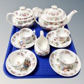 A tray containing an eleven-piece 19th century hand-painted floral tea service.