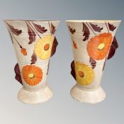 A pair of Beswick hand painted pottery vases, height 23 cm.