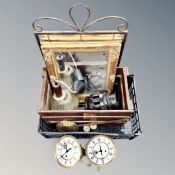 A wooden crate containing mirrors, clock movements, weights, pendulum, cart wheel hub.