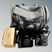 A Miranda camera bag containing a Canon EOS 5 camera body with auto drive and flash,