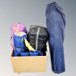 A box containing camping equipment to include tents, folding chair.