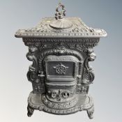 An ornate French cast iron log burner,