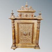 A 19th century carved beech panel door wall cabinet.