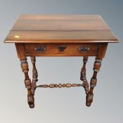 An antique style side table fitted a drawer