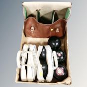 Three bags containing lawn bowls.