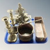 A tray containing antique metal ware to include Victorian brass candlesticks, toasting fork, trivet,