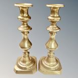 A pair of Victorian brass candlesticks