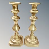 A pair of Victorian brass candlesticks