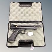 A Crosman .22 CO2 powered bolt action air pistol in hard carry case.