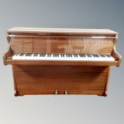 A Kemble Minx piano in lacquered mahogany case
