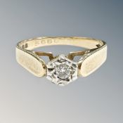 A 9ct yellow gold ring set with a small diamond, 2.3g.