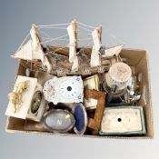 A box containing model galleon, antique mantle clock, old paraffin lamp, photograph frames etc.