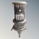 A metal paraffin heater and stove