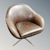 A 20th entury brown vinyl upholstered swivel armchair on chrome base (a/f)