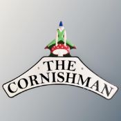 A cast iron wall plaque, the Cornishman.