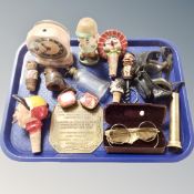 A tray containing assorted collectables to include novelty cork screw and bottle stoppers,